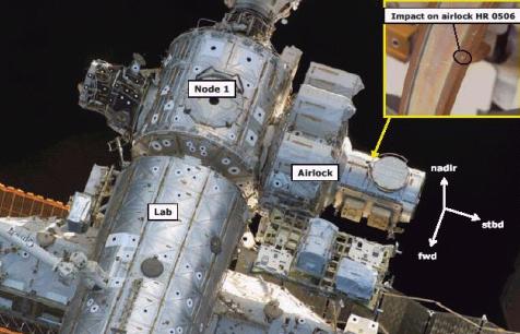 ISS handrail debris damage